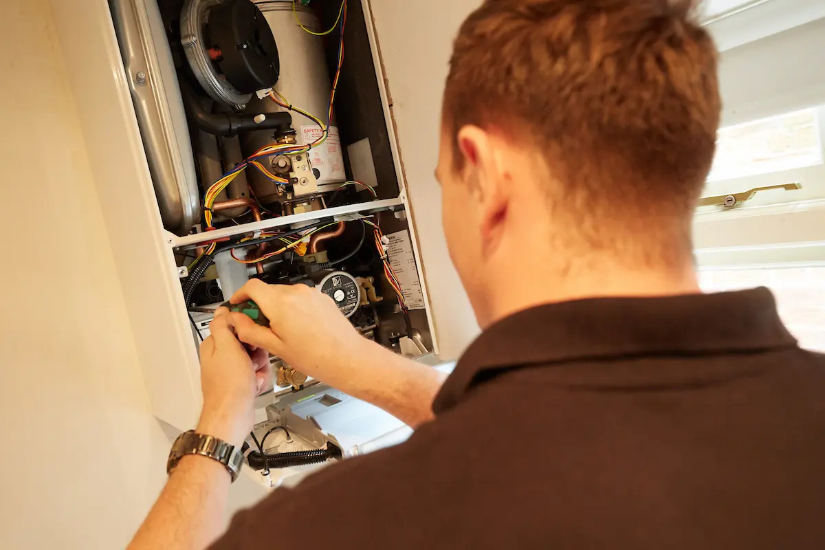 Vector Heat engineer servicing a boiler